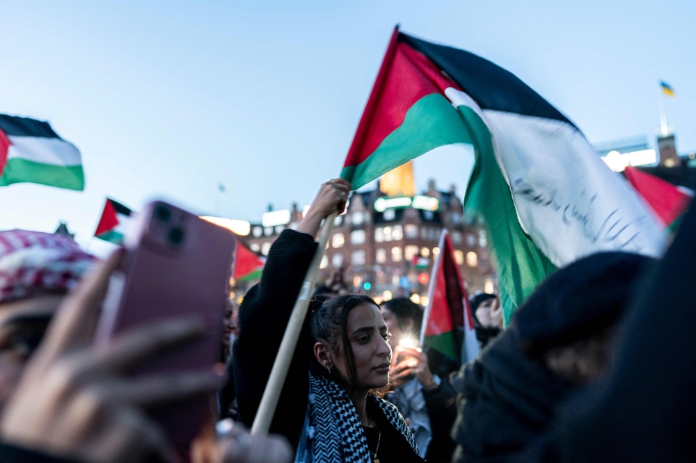 Pro-Palestinian protestors take part in a rally in Copenhagen, Denmark on October 14, 2023. A pro-Palestinian rally attracted some 1,000 people to downtown Copenhagen Saturday as Danes showed opposition to a huge Israeli military response in Gaza to last week's bloody incursion into Israel by Hamas. (Photo by Rasmus Flindt Pedersen / Ritzau Scanpix / AFP) / Denmark OUT
