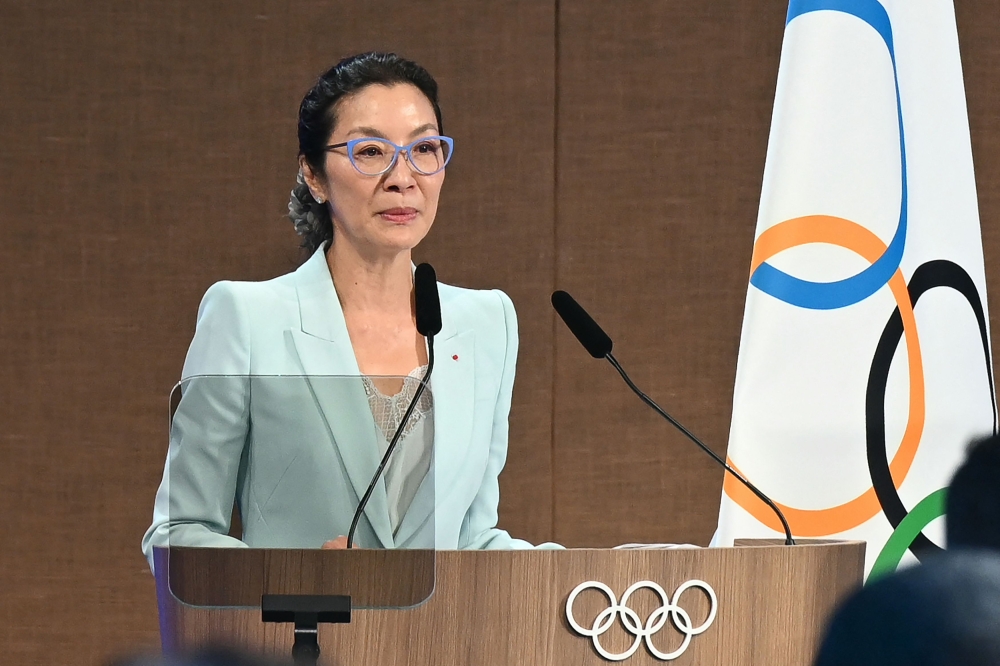 Malaysian actress Michelle Yeoh takes the oath as member of the International Olympic Committee (IOC) during the third day of the 141st IOC session in Mumbai on October 17, 2023. Photo by INDRANIL MUKHERJEE / AFP