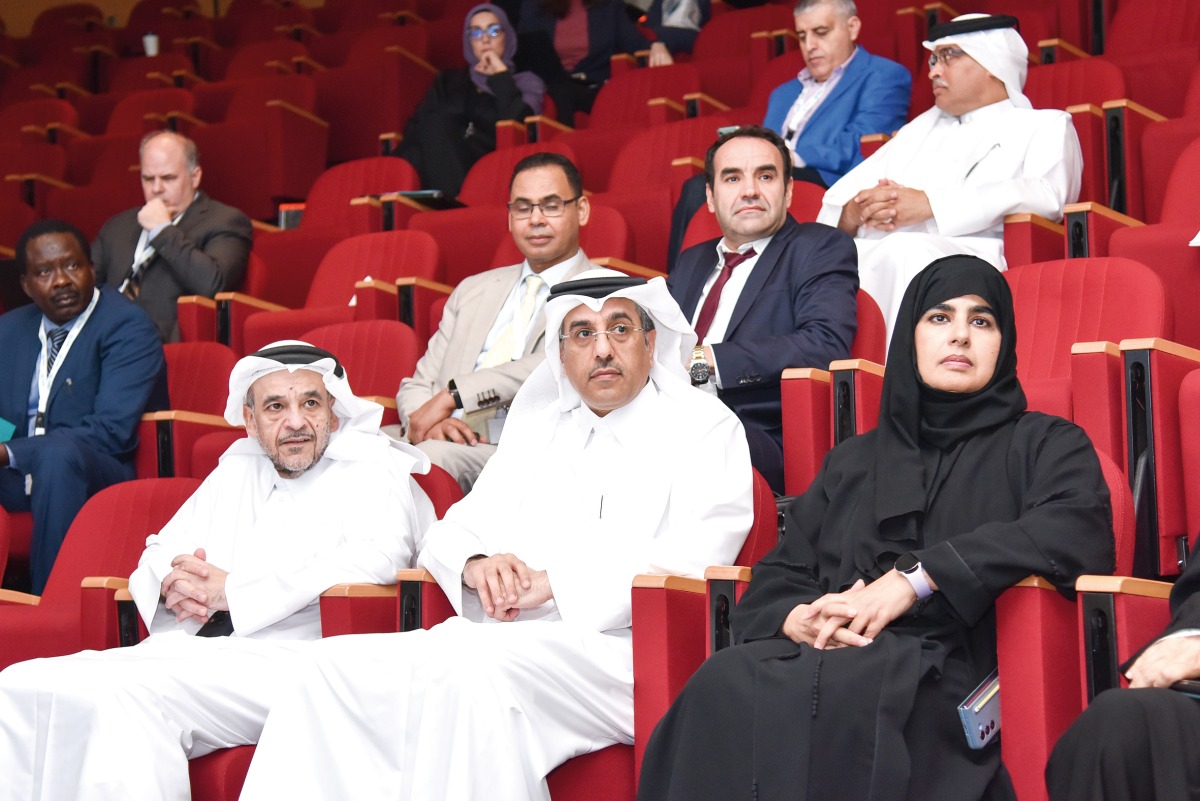 Minister of Labour H E Dr. Ali bin Smaikh Al Marri (centre), President of Qatar University H E Dr. Omar Al Ansari (left), QU Vice-President for Research and Graduate Studies Dr. Maryam Al Maadeed, and others at the seminar.
