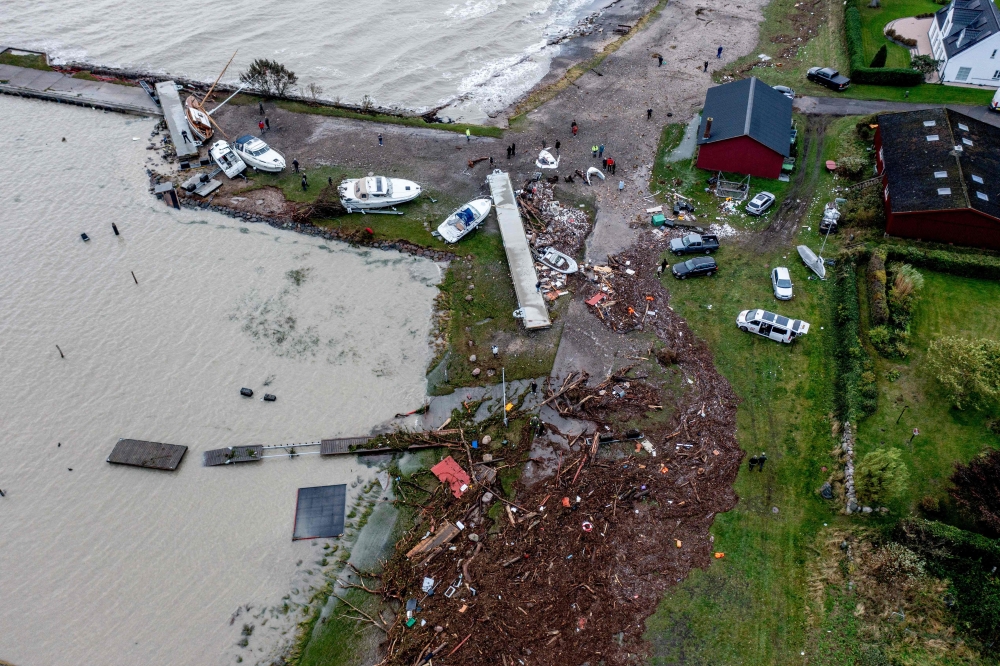 An aerial picture taken on October 21, 2023 shows the damage on the coast in Hesnaes, on the Danish island of Falster after a storm hit the area. (Photo by Ingrid Riis / Ritzau Scanpix / AFP) 