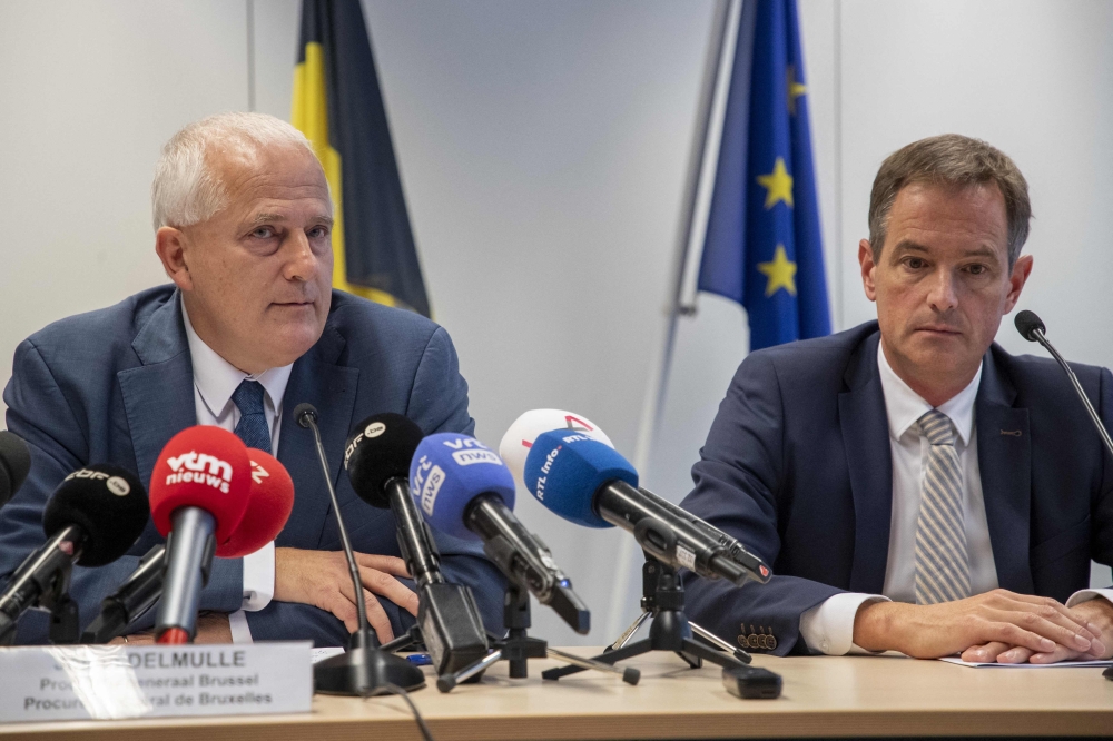 Brussels' public prosecutor Tim De Wolf (right) and Brussels' general prosecutor Johan Delmulle look on during a press conference in Brussels, October 22, 2023. (Photo by Nicolas Maeterlinck / Belga / AFP)