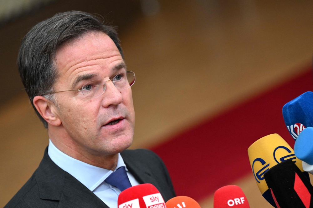 Netherlands' Prime Minister Mark Rutte addresses the press as he arrives for a EU leaders Summit at The European Council Building in Brussels on October 26, 2023. (Photo by John Thys / AFP)