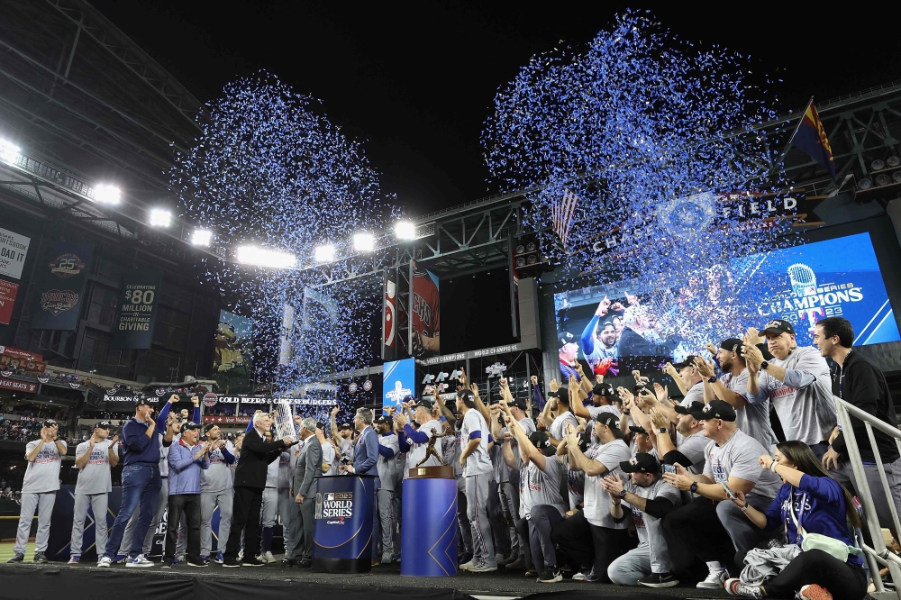 The Texas Rangers are awarded the Commissioner's Trophy after defeating the Arizona Diamondbacks in Game Five to win the World Series at Chase Field on November 01, 2023 in Phoenix, Arizona. Photo by Christian Petersen / GETTY IMAGES NORTH AMERICA / Getty Images via AFP)
