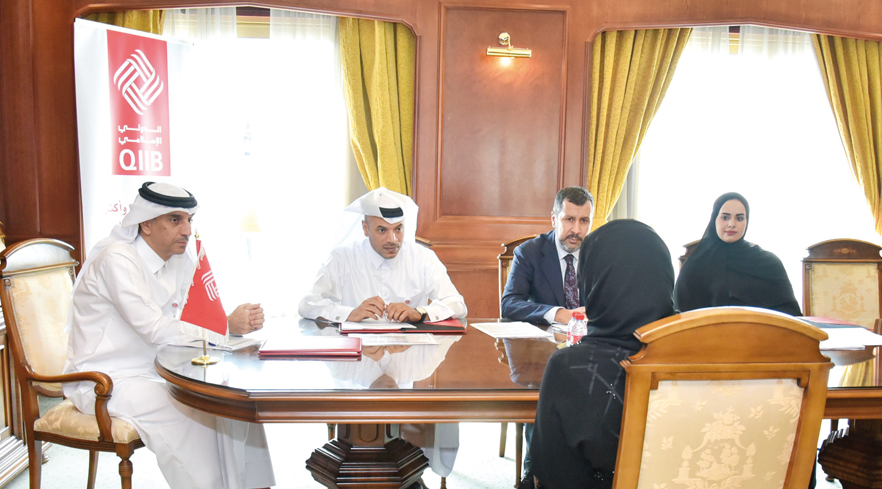 QIIB Deputy CEO Jamal Abdullah Al Jamal, QIIB Chief of Human Resources and Administration Ali Al Mesaifri with other officials during the meeting.