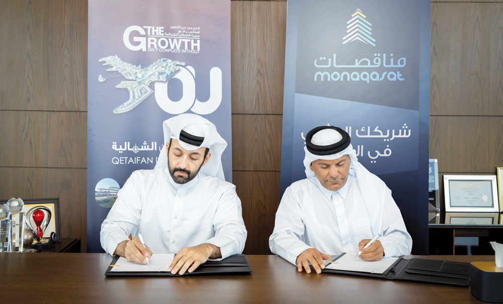 Chairman and Managing Director of Qetaifan Projects Sheikh Nasser bin Abdulrahman Al Thani and Monaqasat representative and board member Abdelaziz Al Tamimi signing the agreement.