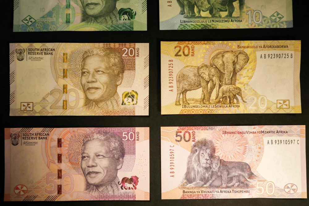 File photo: Newly upgraded South African Rand banknotes depicting former South African president Nelson Mandela are displayed at the Nelson Mandela Foundation in Johannesburg on May 4, 2023. (Photo by Phill Magakoe / AFP)

