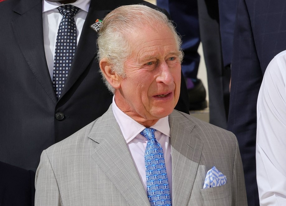 Britain's King Charles III poses for a family photo with other participating world leaders and delegates during the COP28 United Nations climate summit in Dubai on December 1, 2023. (Photo by Giuseppe Cacace / AFP)