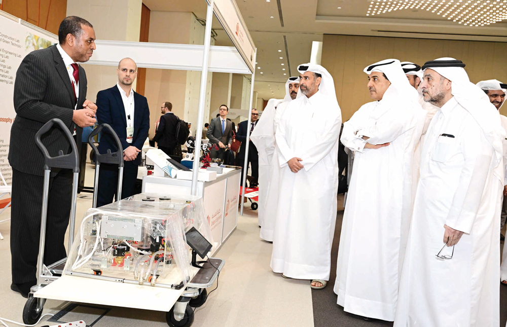 Minister of Environment and Climate Change H E Sheikh Dr. Faleh bin Nasser bin Ahmed bin Ali Al Thani, President of QU Dr. Omar Al Ansari with other officials touring the exhibition.