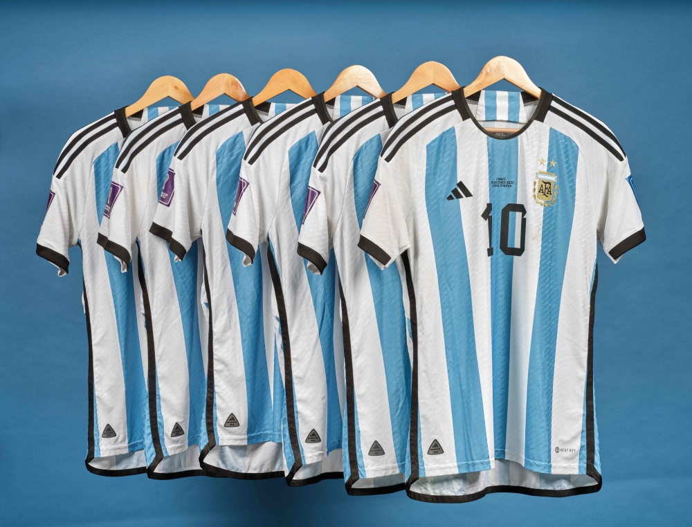This undated photo courtesy of Sotheby's shows Lionel Messi's set of six match worn shirts from the 2022 FIFA World Cup. (Photo by SOTHEBY'S / AFP)