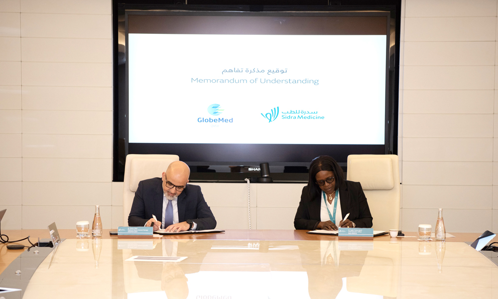 CEO of Sidra Medicine Dr. Iyabo Tinubu-Karch (right) and Regional Deputy GM of GlobeMed Dr. Samer Jaber signing the agreement.