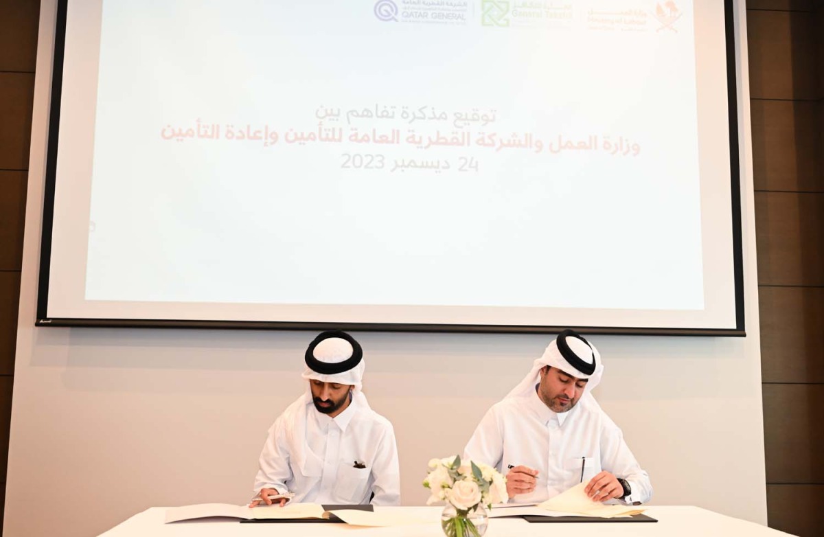 Abdulrahman Mohammed Talfat, Head of the Department of Qualifying Skills Development at the Ministry of Labour, and Mubarak Jassim Al Menkhis, Acting Group Head for Human Resources and Administration at QGRI, signing the agreement. 