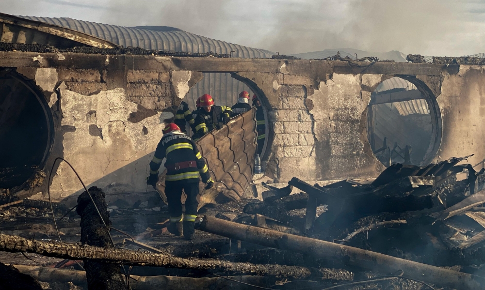 This handout photo taken and made available by the Inspectorate of Emergency Situations Prahova (ISU Prahova) on December 26, 2023 shows firemen working to extinguish a fire at the site of teh 'Ferma Dacilor' guest house in Tohani, Romania. Photo by Handout / ISU PRAHOVA - Inspectorate of Emergency Situations Prahova / AFP