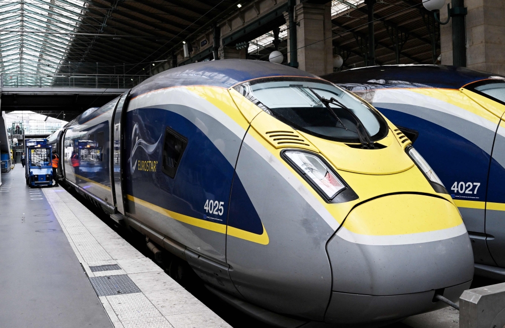 (Files) A Eurostar train is parked at a platform of the Paris' Gare du Nord station on August 3, 2023. (Photo by Stefano Rellandini / AFP)
 