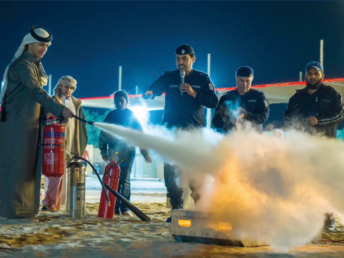 Youngsters receiving fire fighting training at Al Enna camp in Sealine.