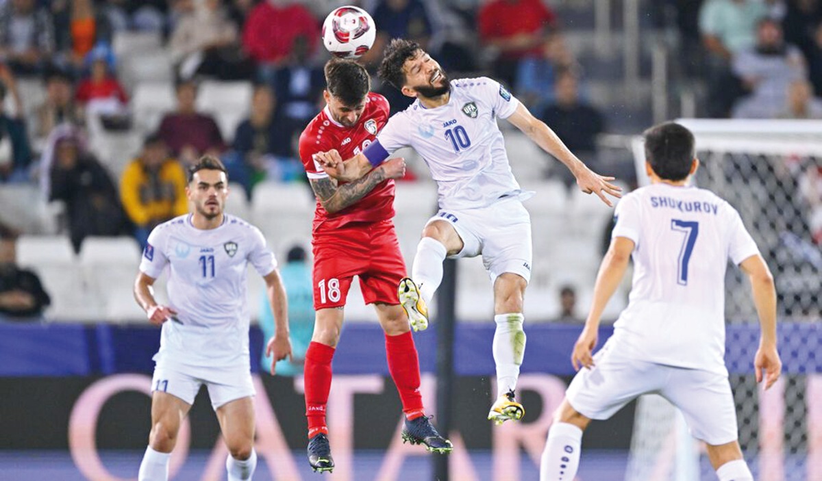 Action during Group B match between Uzbekistan and Syria at Jassim Bin Hamad Stadium yesterday.  