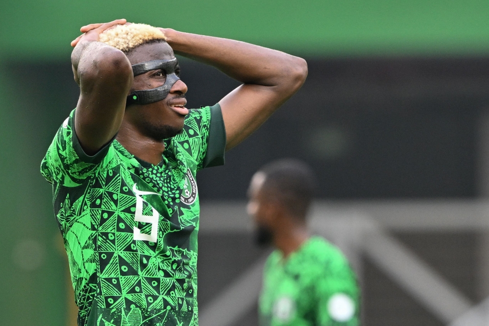 Nigeria's forward #9 Victor Osimhen looks on during the Africa Cup of Nations (CAN) 2024 group A football match between Nigeria and Equatorial Guinea at the Alassane Ouattara Stadium in Ebimpe, Abidjan, on January 14, 2024. (Photo by Issouf SANOGO / AFP)
