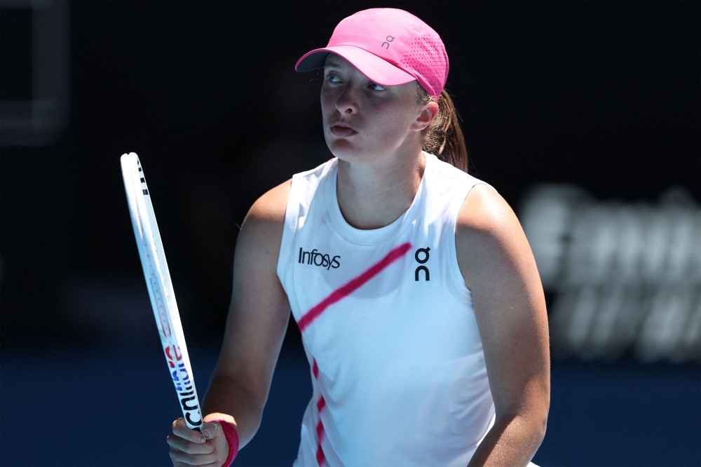 Poland's Iga Swiatek reacts on a match point against USA's Sofia Kenin during their women's singles match on day three of the Australian Open tennis tournament in Melbourne on January 16, 2024. Photo by Martin KEEP / AFP