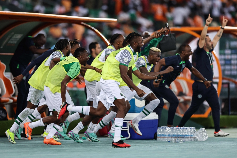 Nigeria's players celebrate after winning at the end of the Africa Cup of Nations (CAN) 2024 group A football match between Ivory Coast and Nigeria at the Alassane Ouattara Olympic Stadium in Ebimpe, Abidjan, on January 18, 2024. (Photo by Franck Fife / AFP)