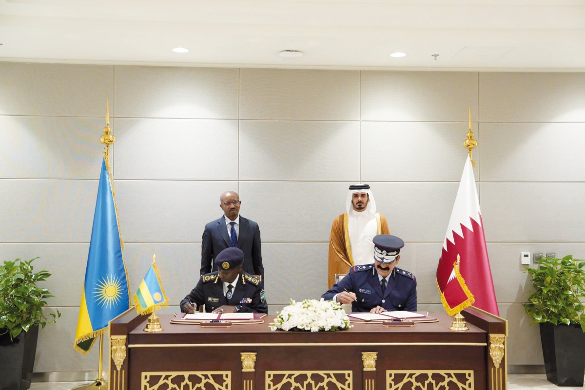 Minister of Interior H E Sheikh Khalifa bin Hamad bin Khalifa Al Thani and Minister of Interior of Rwanda H E Alfred Gasana look on as Director of Public Security H E Major General Abdullah Mohammed Al Suwaidi and Inspector General of Rwanda National Police H E Commissioner General Felix Namuhoranye sign an MoU for bilateral cooperation in security.