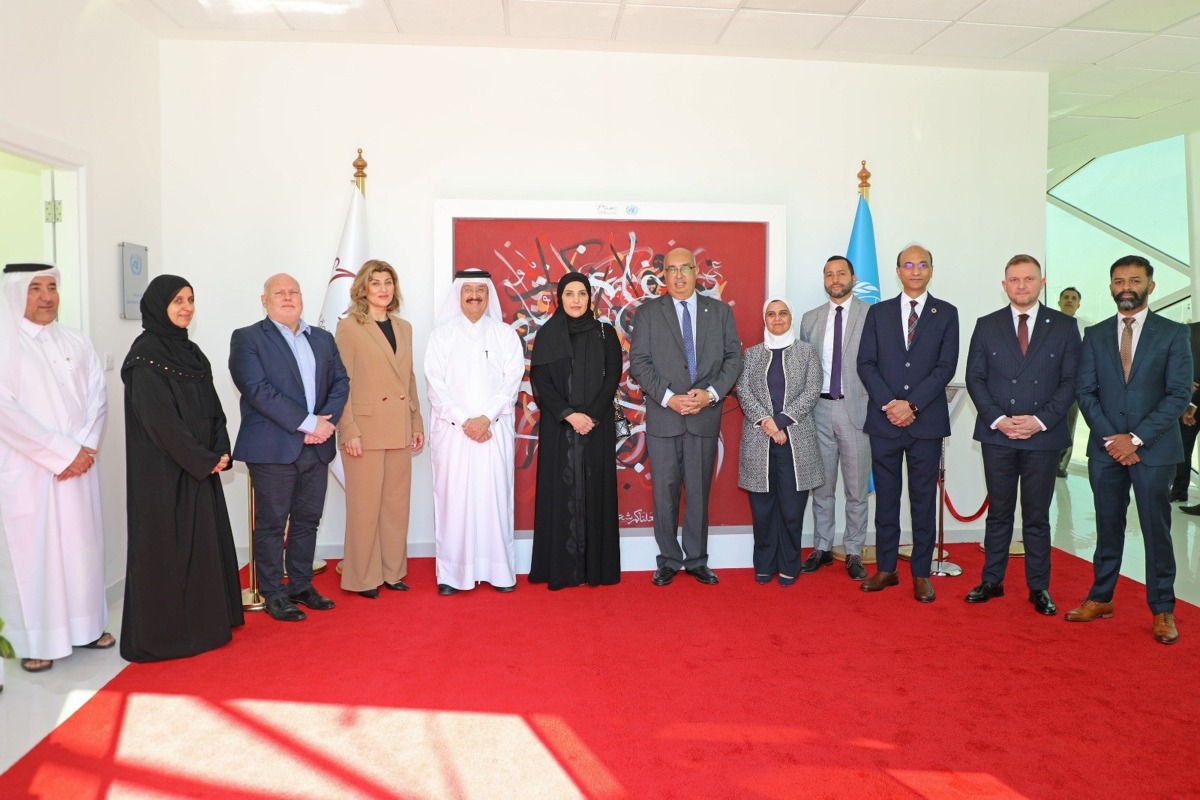 NHRC Chairperson H E Maryam bint Abdullah Al Attiyah with other officials during the inauguration of the painting of Litaarafu at the UN House in Doha.