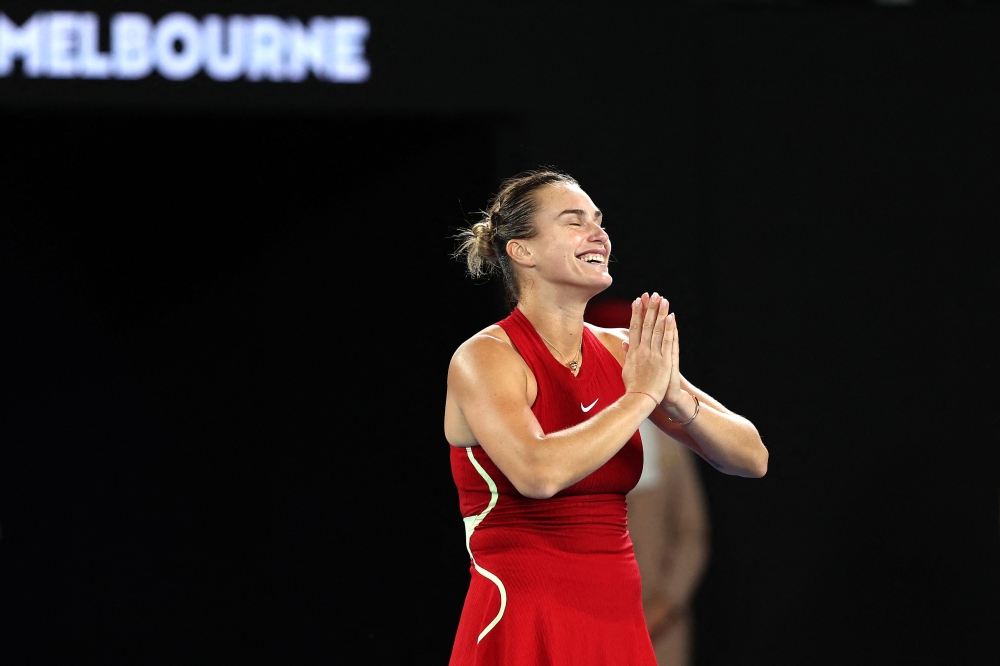 Belarus' Aryna Sabalenka reacts after her victory against USA's Coco Gauff on January 25, 2024. (Photo by Martin Keep / AFP) /