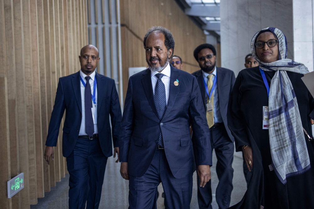 President of Somalia Hassan Sheikh Mohamud (C) makes his way to conduct a press conference following the 37th Ordinary Session of the Assembly of the African Union (AU) at the AU headquarters in Addis Ababa on February 17, 2024. (Photo by Michele Spatari / AFP)
