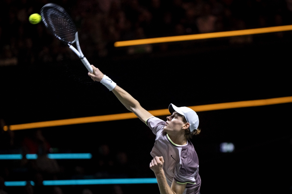 Italy's Jannik Sinner serves to Australia's Alex de Minaur during their men final at ABN AMRO Open tennis tournament at Ahoy Arena, in Rotterdam on February 18, 2024. (Photo by Sander Koning / ANP / AFP) / Netherlands OUT
