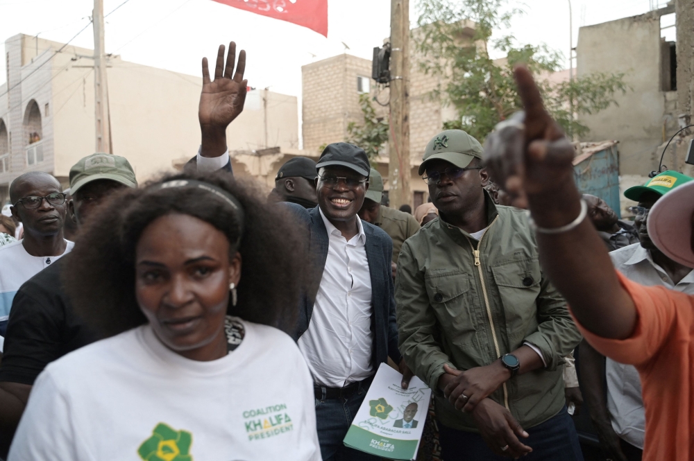 Senegalese presidential candidate Khalifa Sall greets supporters during a campaign meeting in Hann Bel-Air, Dakar, on February 19, 2024. (Photo by Seyllou / AFP)
