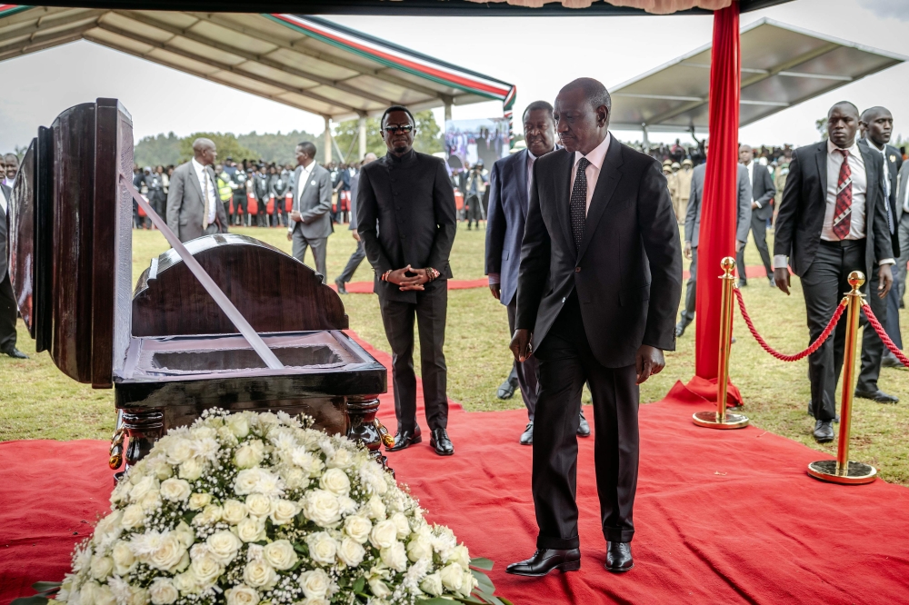 President of Kenya William Ruto approaches the coffin of Kelvin Kiptum while attending the funeral proceedings of the late marathon runner in Chepkorio on February 23, 2024. (Photo by LUIS TATO / AFP)
