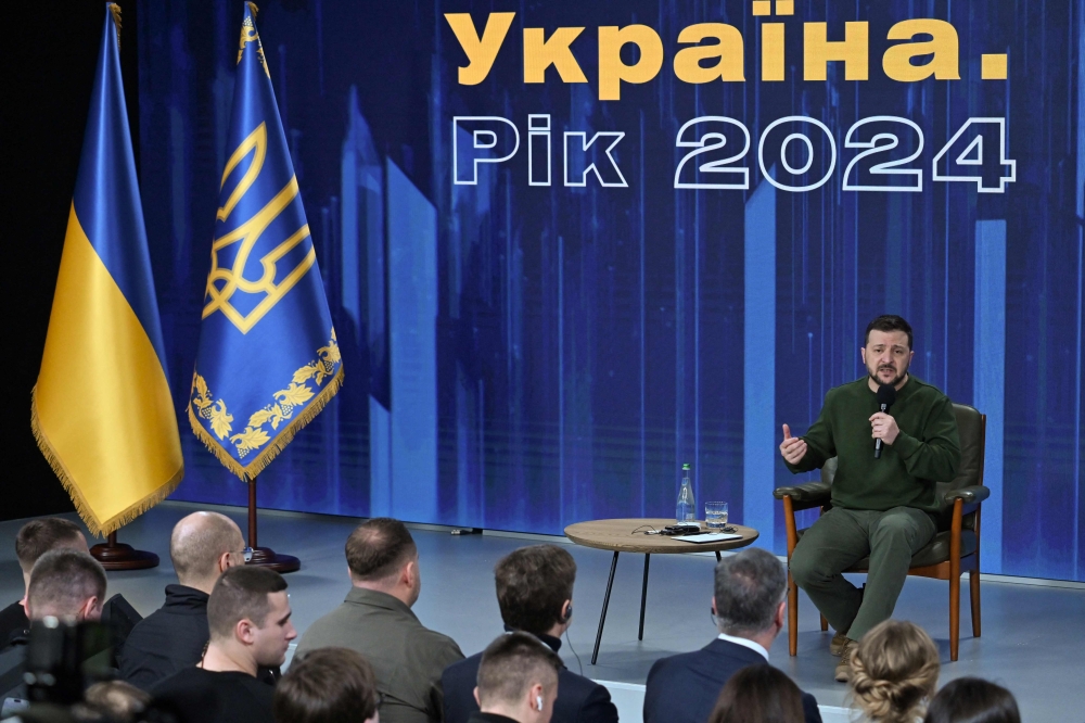 Ukraine's President Volodymyr Zelensky attends a press conference during the 