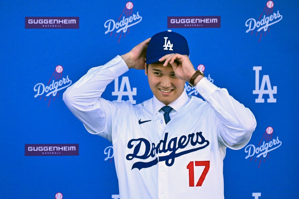 Japanese baseball player Shohei Ohtani attends a press conference on his presentation after signing a ten-year deal with the Los Angeles Dodgers at Dodgers Stadium in Los Angeles, California on December 14, 2023. Photo by Frederic J. Brown / AFP

