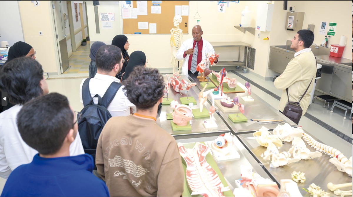 Dr. Avelin Malyango, Assistant Professor of Anatomy in Radiology and Assistant Dean for Medical Student Affairs, with participating high school students during an anatomy lab activity.