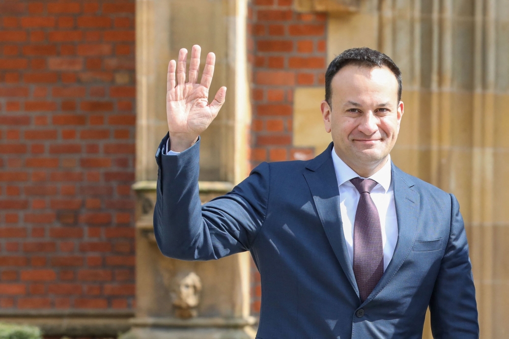 Ireland's Prime Minister Leo Varadkar speaks to journalists as he leaves on the final day of a conference to mark the 25th anniversary of the Good Friday Agreement, at Queen's University in Belfast on April 19, 2023. Photo Credit: PAUL FAITH / AFP.