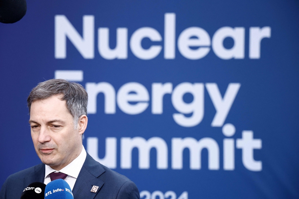 Belgium's Prime Minister Alexander de Croo speaks to the press prior to the International Atomic Energy Agency (IAEA) Nuclear Energy Summit at the Brussels Expo convention centre in Brussels on March 21, 2024. Photo Credit: KENZO TRIBOUILLARD / AFP.