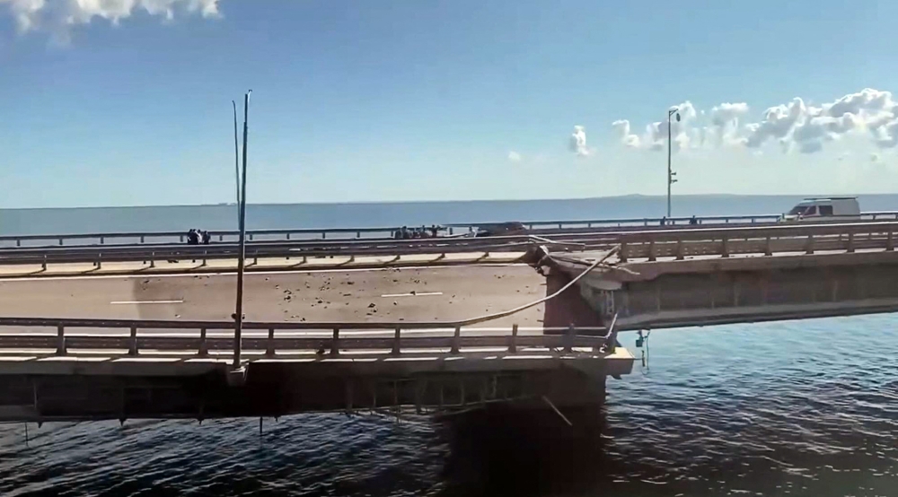 This video grab taken from a Crimea24TV footage on July 17, 2023 shows the damaged Kerch bridge -- linking Crimea to Russia -- which was heavily damaged following an attack. (Photo by Crimea24TV / AFP)

