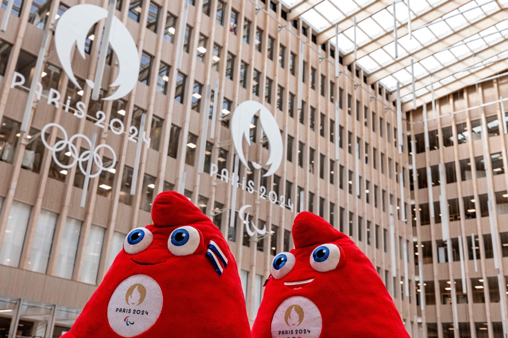 A photograph taken in Saint-Denis, north of Paris on March 28, 2024, shows two official Olympic Phryges mascots for the Paris 2024 Summer Olympic and Paralympic Games displayed at headquarters of the Paris 2024 Olympics and Paralympics Organizing Committee (Cojo). (Photo by Joel Saget / AFP)