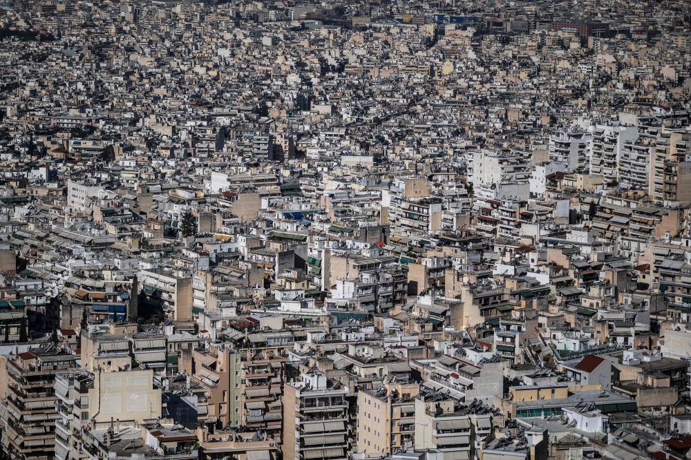 This aerial photograph taken on March 30, 2024 shows the buildings in Athens. (Photo by Aris MESSINIS / AFP)
