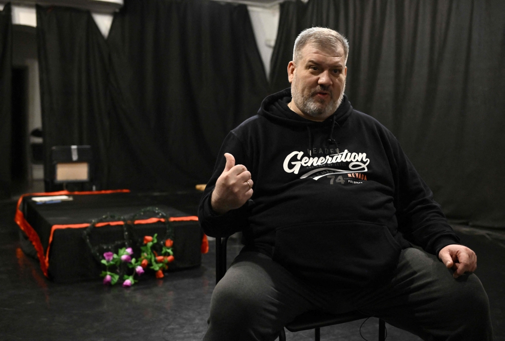 Theatre director Anatoliy Levchenko, 54-years-old, from war-torn Mariupol, speaks during an interview for AFP. (Photo by Genya Savilov / AFP)
