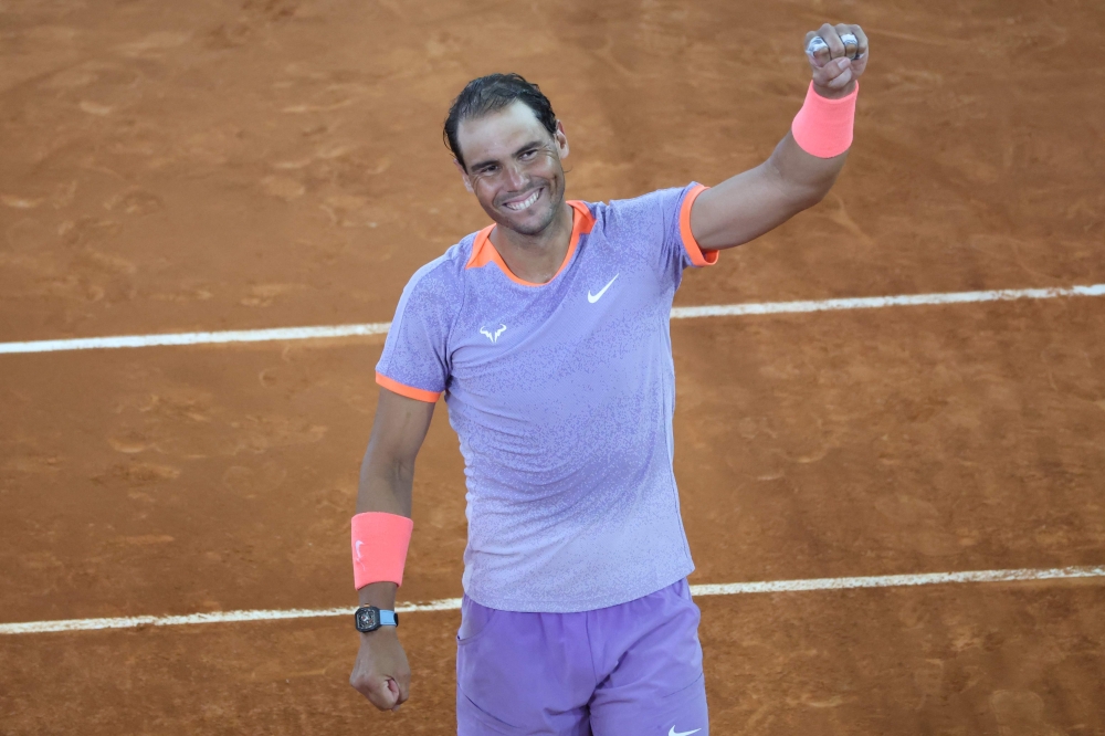 Spain's Rafael Nadal celebrates victory against Australia's Alex De Minaur at the end of the second round of the 2024 ATP Tour Madrid Open tournament tennis match at Caja Magica in Madrid on April 27, 2024. (Photo by Thomas COEX / AFP)

