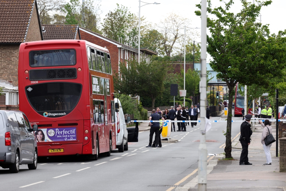 Police officers at a crime scene in Hainault, east of London on April 30, 2024 where 36-year-old man wielding a sword was arrested following an attack on members of the public and two police officers. (Photo by Adrian Dennis / AFP)