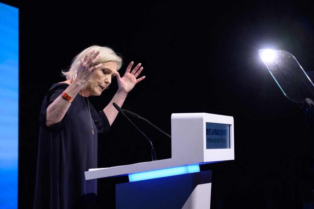President of the French far-right Rassemblement National (RN) parliamentary group Marine Le Pen delivers a speech during a campaign meeting for the forthcoming European union (EU) parliamentary elections scheduled for June 2024, in Perpignan, southern France, on May 1, 2024. (Photo by Ed JONES / AFP)
