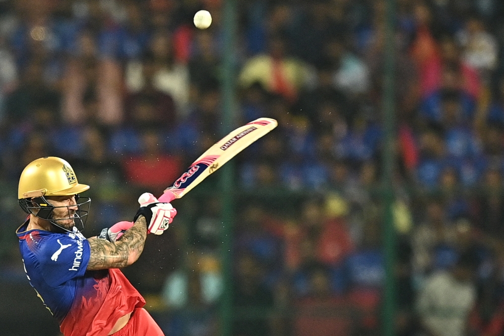 Royal Challengers Bengaluru's captain Faf du Plessis plays a shot during the Indian Premier League (IPL) Twenty20 cricket match between Royal Challengers Bengaluru and Gujarat Titans at the M Chinnaswamy Stadium in Bengaluru on May 4, 2024. (Photo by Idrees MOHAMMED / AFP)