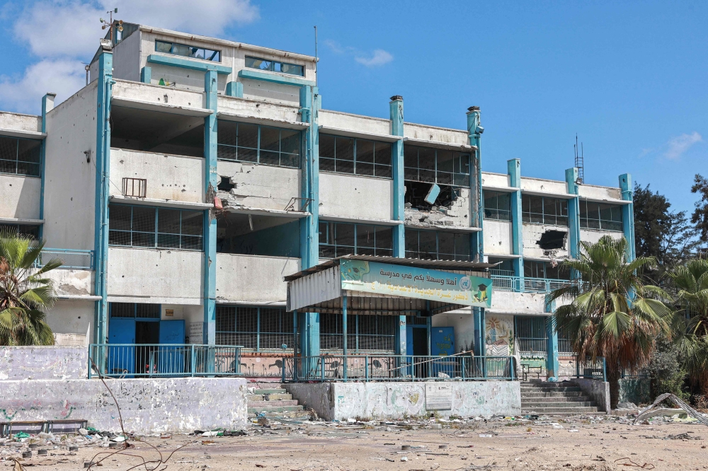 This picture taken on May 7, 2024 shows a view of the damaged building of a preparatory school for boys run by the UNRWA at the Shati camp for Palestinian refugees, west of Gaza City. (Photo by AFP)