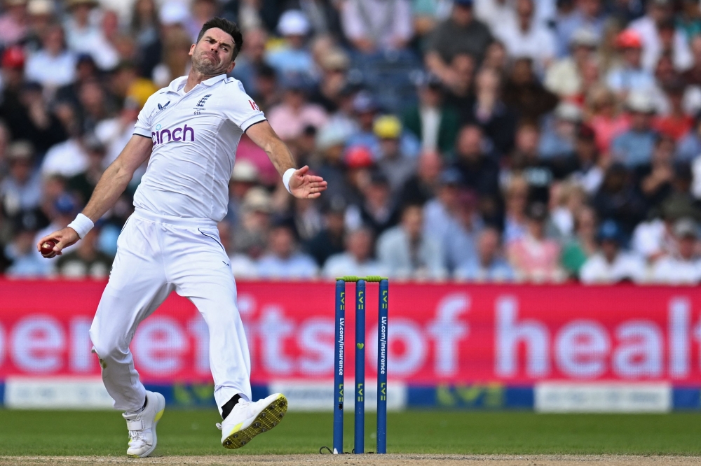 (FILES) England's James Anderson bowls on day three of the fourth Ashes cricket Test match between England and Australia at Old Trafford cricket ground in Manchester, north-west England on July 21, 2023. (Photo by Oli SCARFF / AFP)
