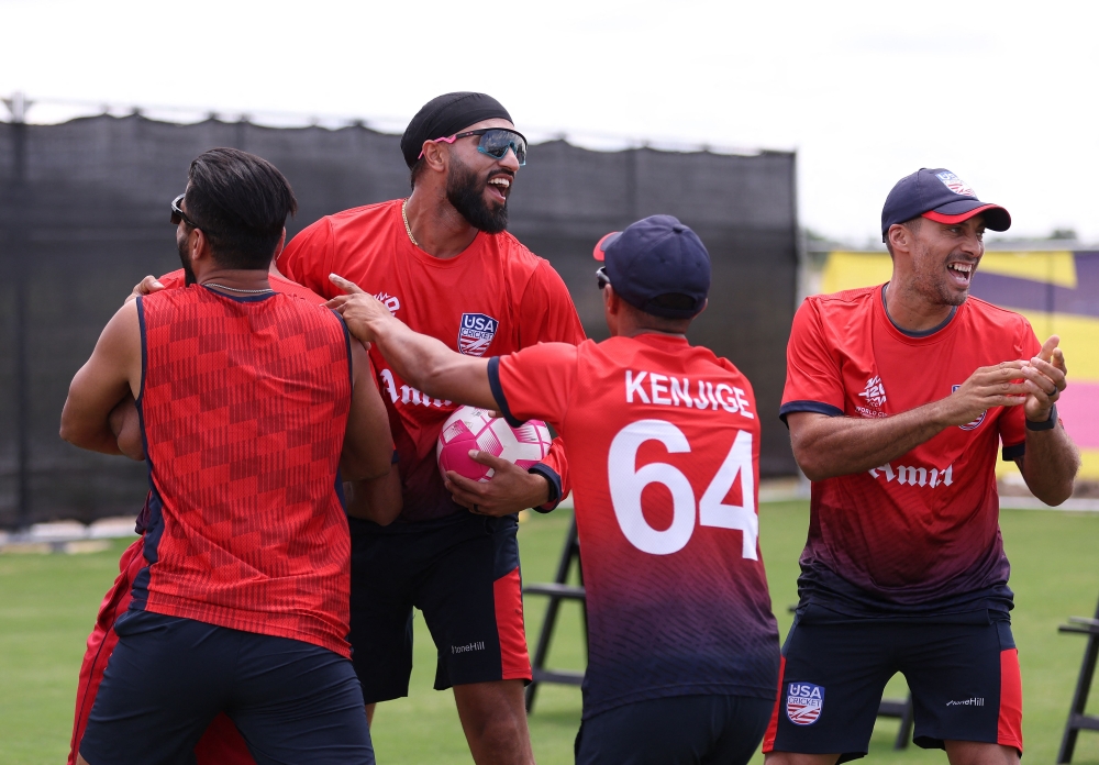 Members of the USA team celebrate a training win, during a net session as part of the ICC Men's T20 cricket World Cup West Indies & USA 2024 at Grand Prairie cricket Stadium on May 31, 2024 in Dallas, Texas. (Photo by Robert Cianflone/Getty Images/AFP)