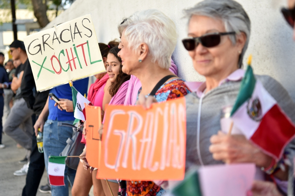 Supporters of Mexico's opposition presidential candidate Xochitl Galvez of the Fuerza y Corazon por Mexico coalition party wait for her arrival during the general election in Mexico City, on June 2, 2024. Photo by Rodrigo Oropeza / AFP.