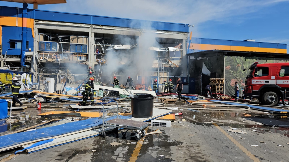 A handout picture made available by Emergency Situations Inspectorate (ISU) Botosani shows Romanian rescue workers intervening on the site of a strong explosion at a commercial center in Botosani, Romania, on June 7, 2024. Photo by ISU BOTOSANI / AFP
