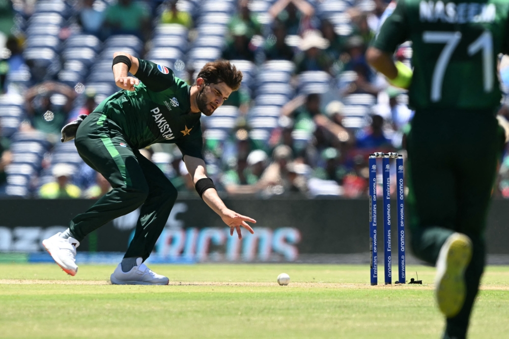 Pakistan's Shaheen Shah Afridi dives for the ball during the ICC men's Twenty20 World Cup 2024 group A cricket match between the USA and Pakistan at the Grand Prairie Cricket Stadium in Grand Prairie, Texas, on June 6, 2024. (Photo by Andrew Caballero-Reynolds / AFP) 