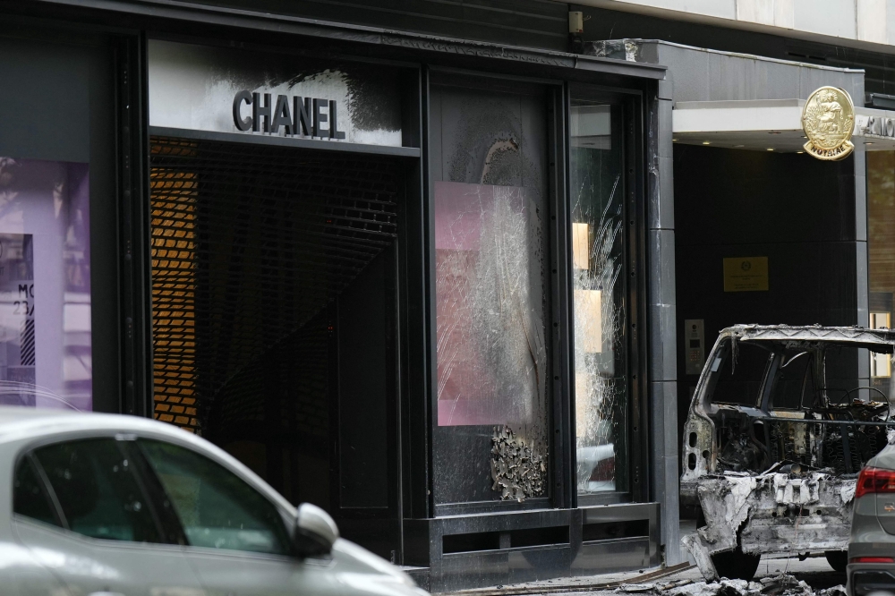 A photo shows a Chanel boutique near the Champs-Elysees avenue in Paris that was attacked with a ram car by a team of escaped robbers, police sources said, on June 10, 2024. (Photo by Dimitar DILKOFF / AFP)