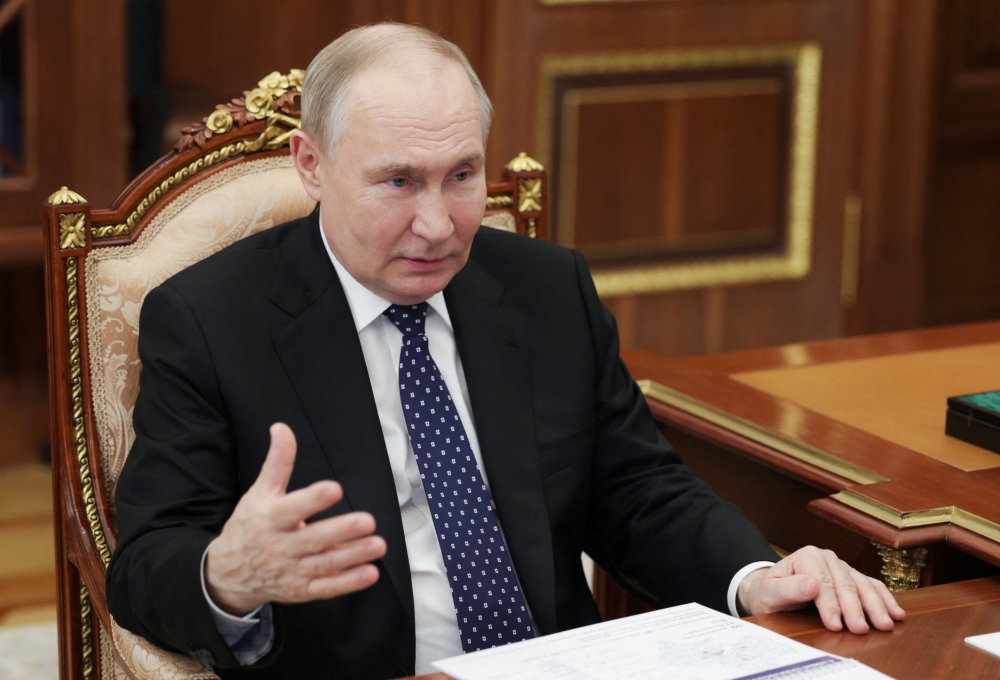 In this pool photograph distributed by the Russian state agency Sputnik, Russia's President Vladimir Putin meets with Moscow Region Governor in Moscow on June 17, 2024. (Photo by Alexander KAZAKOV / POOL / AFP)
